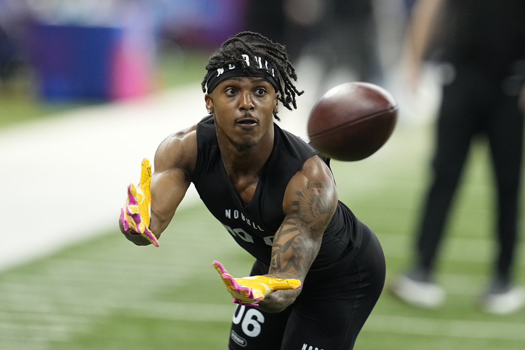 Arizona wide receiver Jacob Cowing hauls in a pass during a drill at the 2024 NFL Draft Combine