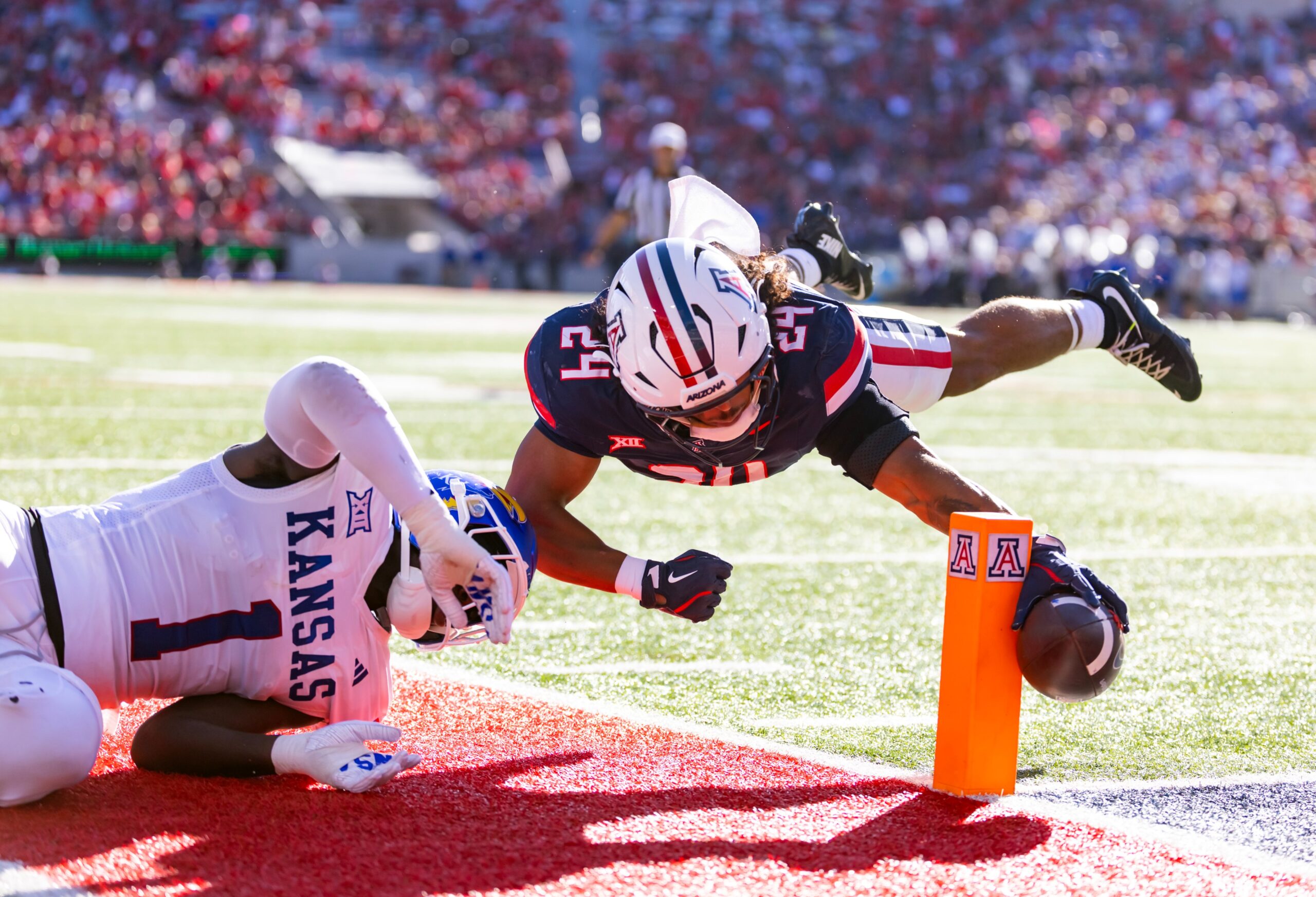 Arizona takes down Kansas 24-20 on Homecoming to clinch a bowl game berth as Noah Fifita ties the program's all-time passing touchdown record.