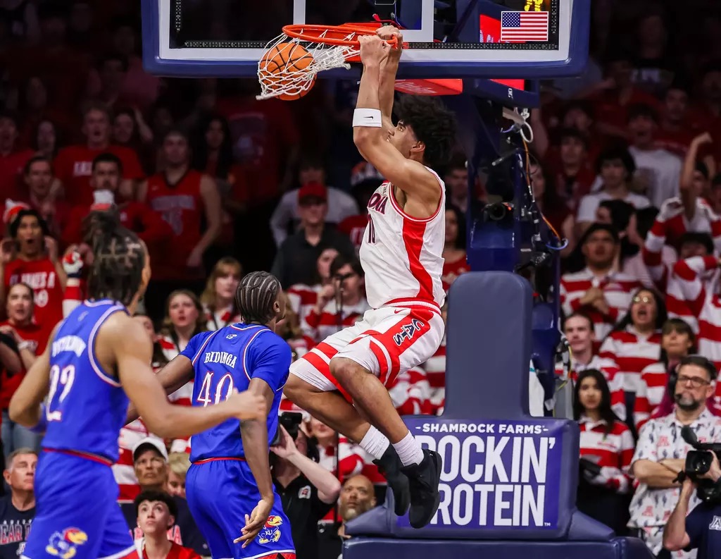 Koa Peat returned from injury as No. 2 Arizona men's basketball soared past No. 14 Kansas 84-61 to clinch a share of the Big 12 title.